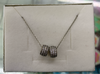 Cadena plata rodinada rueditas con perlitas
