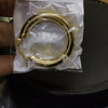 Aretes acero argollas doradas