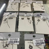 Aretes acero plateado dijes colgando por ambos lados